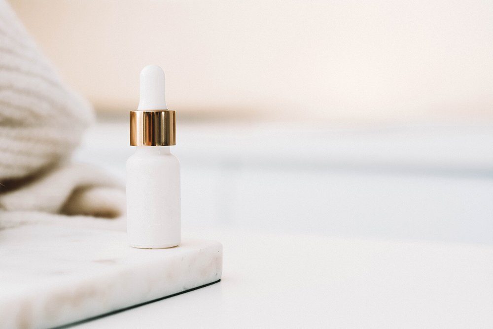 Serum bottle on marble | Glow Skin & Spa, Baldivis